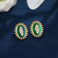 1 Pair Nordic Style XUPING Simple Style Oval Football Enamel Inlay 304 Stainless Steel Artificial Gemstones 18K Gold Plated Ear Studs main image 5