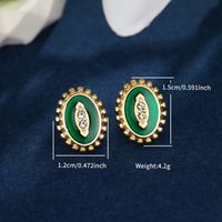 1 Pair Nordic Style XUPING Simple Style Oval Football Enamel Inlay 304 Stainless Steel Artificial Gemstones 18K Gold Plated Ear Studs main image 2