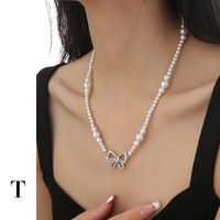 Sweet Simple Style Bow Knot Imitation Pearl Brass Zircon White Gold Plated Women's Pendant Necklace main image 2