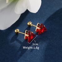 1 Pair XUPING Simple Style Shiny Triangle Inlay 304 Stainless Steel Artificial Gemstones 18K Gold Plated Raw Steel Ear Studs main image 10