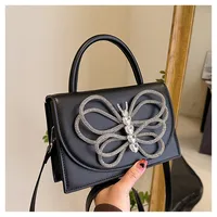 Femmes Petit Faux Cuir Noeud D'Arc Vêtement De Rue Boucle Magnétique Sac À Main sku image 1