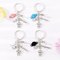 Simple Style Letter Cup Teeth Alloy Plating Bag Pendant Keychain main image 1