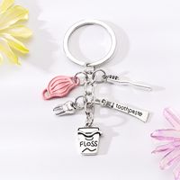 Simple Style Letter Cup Teeth Alloy Plating Bag Pendant Keychain sku image 1