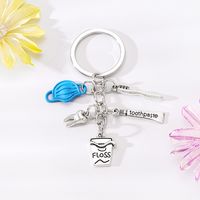 Style Simple Lettre Coupe Dents Alliage Placage Pendentif De Sac Porte-Clés sku image 2