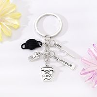 Style Simple Lettre Coupe Dents Alliage Placage Pendentif De Sac Porte-Clés sku image 4