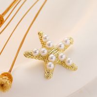 1 Pair Simple Style Starfish Inlay Alloy Artificial Pearls 14K Gold Plated Ear Studs main image 5