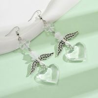 1 Pair Casual Simple Style Heart Shape Wings Flower Plating Hollow Out Arylic Drop Earrings main image 7
