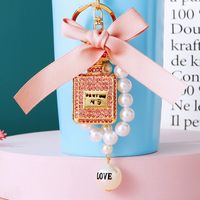 Cute Letter Bow Knot Perfume Bottle Metal Women's Keychain main image 3