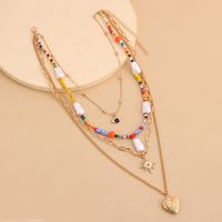 Casual Hip-Hop Devil's Eye Heart Shape Beaded Alloy Women's Layered Necklaces sku image 1