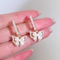 1 Pair Simple Style Classic Style Bow Knot Inlay Alloy Rhinestones Drop Earrings main image 1