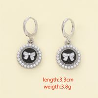 1 Pair Casual Simple Style Devil's Eye Bow Knot Asymmetrical Zinc Alloy Artificial Pearls Drop Earrings main image 2