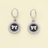 1 Pair Casual Simple Style Devil's Eye Bow Knot Asymmetrical Zinc Alloy Artificial Pearls Drop Earrings sku image 1