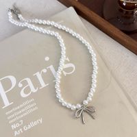 Simple Style Classic Style Bow Knot Imitation Pearl Alloy Beaded Women's Earrings Necklace main image 7