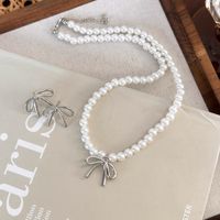 Simple Style Classic Style Bow Knot Imitation Pearl Alloy Beaded Women's Earrings Necklace main image 5