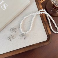 Simple Style Classic Style Bow Knot Imitation Pearl Alloy Beaded Women's Earrings Necklace main image 6