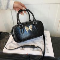 Women's Medium Pu Leather Solid Color Butterfly Classic Style Oval Zipper Crossbody Bag main image video
