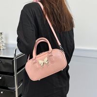 Women's Medium Pu Leather Solid Color Butterfly Classic Style Oval Zipper Crossbody Bag main image 5