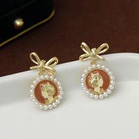 1 Pair Vacation Simple Style Bow Knot Inlay Copper Pearl 18K Gold Plated Drop Earrings main image 5