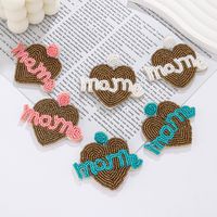 1 Pair Elegant Simple Style Letter Beaded Cloth Glass Ear Studs main image 1