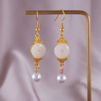 1 Pair Simple Style Classic Style Solid Color Patchwork Hollow Out Synthetic Gemstones Imitation Pearl Alloy Resin Zircon Drop Earrings main image 1