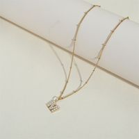 Edelstahl 304 14 Karat Vergoldet Einfacher Stil Inlay Brief Perle Halskette Mit Anhänger main image 3