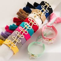 Simple Style Bow Knot Cloth Shell Pearls Copper Beaded Knitting Women's Wristband main image 1