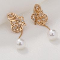 1 Pair IG Style Exaggerated Simple Style Butterfly Hollow Out Inlay Artificial Pearl Copper Zircon Drop Earrings main image 5