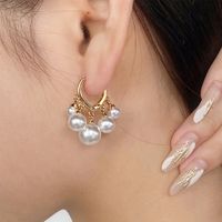 1 Pair IG Style Exaggerated Simple Style Butterfly Hollow Out Inlay Artificial Pearl Copper Zircon Drop Earrings sku image 4