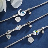 304 Stainless Steel XUPING Simple Style Irregular Enamel Palm Moon Fish Bracelets main image 2