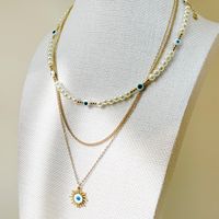 304 Stainless Steel Gold Plated Vacation Tropical Sweet Layered Pearl Inlay Sun Devil's Eye Zircon Layered Necklaces main image 5