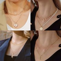 Artificial Pearl Copper 14K Gold Plated Casual Elegant Classic Style Plating Letter Number Heart Shape Pendant Necklace main image 1
