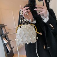 Women's Small Plastic Solid Color Vacation Beach Pearls Hollow String Beach Bag main image video