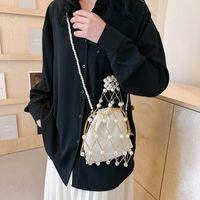 Women's Small Plastic Solid Color Vacation Beach Pearls Hollow String Beach Bag main image 3