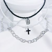 Einfacher Stil Klassischer Stil Kreuzen Brief Saatperle Kupferlegierung Perlen Inlay Künstlicher Kristall Paar Dreilagige Halskette sku image 2