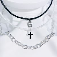 Einfacher Stil Klassischer Stil Kreuzen Brief Saatperle Kupferlegierung Perlen Inlay Künstlicher Kristall Paar Dreilagige Halskette sku image 7