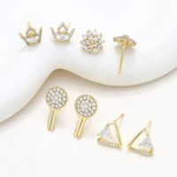1 Pair XUPING Simple Style Crown Flower Key Inlay Copper Artificial Gemstones 18K Gold Plated Ear Studs main image 1