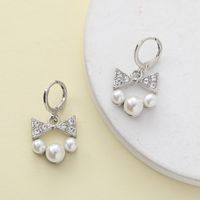 1 Piece Sweet Simple Style Round Letter Bow Knot Hollow Out Inlay Alloy Pearl Zircon Drop Earrings main image 6