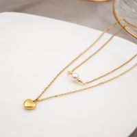 304 Stainless Steel Titanium Steel Gold Plated Simple Style Inlay Heart Shape Artificial Pearls Double Layer Necklaces Sweater Chain main image 6