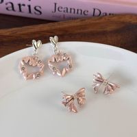 1 Pair Sweet Simple Style Bow Knot Inlay Alloy Zircon Ear Studs main image 1