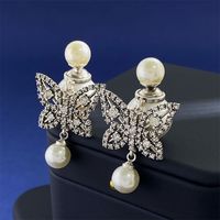 1 Pair Simple Style Commute Butterfly Plating Inlay Copper Rhinestones Pearl 18K Gold Plated Drop Earrings main image 1