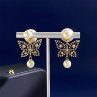1 Pair Simple Style Commute Butterfly Plating Inlay Copper Rhinestones Pearl 18K Gold Plated Drop Earrings sku image 1