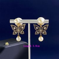 1 Pair Simple Style Commute Butterfly Plating Inlay Copper Rhinestones Pearl 18K Gold Plated Drop Earrings main image 2