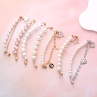 Simple Style Heart Shape Bow Knot Imitation Pearl Beaded Plating Inlay Rhinestones Mobile Phone Chain main image 1