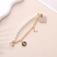 Simple Style Heart Shape Bow Knot Imitation Pearl Beaded Plating Inlay Rhinestones Mobile Phone Chain sku image 6