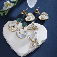 1 Pair XUPING Sweet Dolphin Heart Shape Pearl Enamel Inlay 304 Stainless Steel Artificial Gemstones Artificial Pearls 18K Gold Plated Drop Earrings main image 1