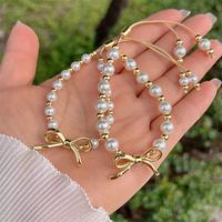 Simple Style Classic Style Bow Knot Artificial Pearl Copper Plating 18K Gold Plated Women's Bracelets main image 9