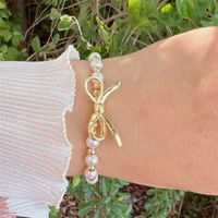 Einfacher Stil Klassischer Stil Bogenknoten Künstliche Perle Kupfer Überzug 18 Karat Vergoldet Frau Armbänder main image 7