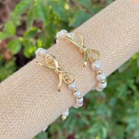 Simple Style Classic Style Bow Knot Artificial Pearl Copper Plating 18K Gold Plated Women's Bracelets main image 1