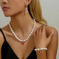 Elegant Einfacher Stil Glänzend Herzform Künstliche Perle Legierung Perlen Inlay Strasssteine Frau Schmuck-Set main image 3