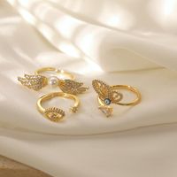 Copper 14K Gold Plated Elegant Lady Classic Style Inlay Devil's Eye Wings Butterfly Imitation Pearl Zircon Open Rings main image 3